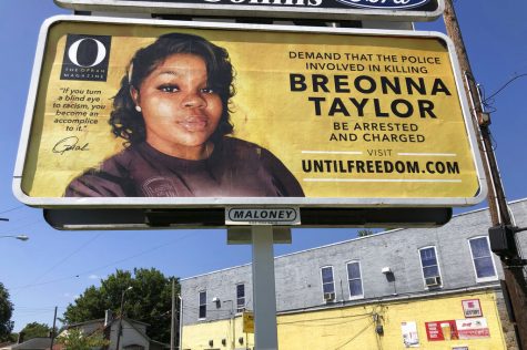 A billboard sponsored by O, The Oprah Magazine, is on display with with a photo of Breonna Taylor, Friday, Aug. 7, 2020 in Louisville, KY. Twenty-six billboards are going up across Louisville, demanding that the police officers involved in Taylor's death be arrested and charged. Taylor was shot multiple times March 13 when police officers burst into her Louisville apartment using a no-knock warrant during a narcotics investigation. No drugs were found. (AP Photo/Dylan T. Lovan)