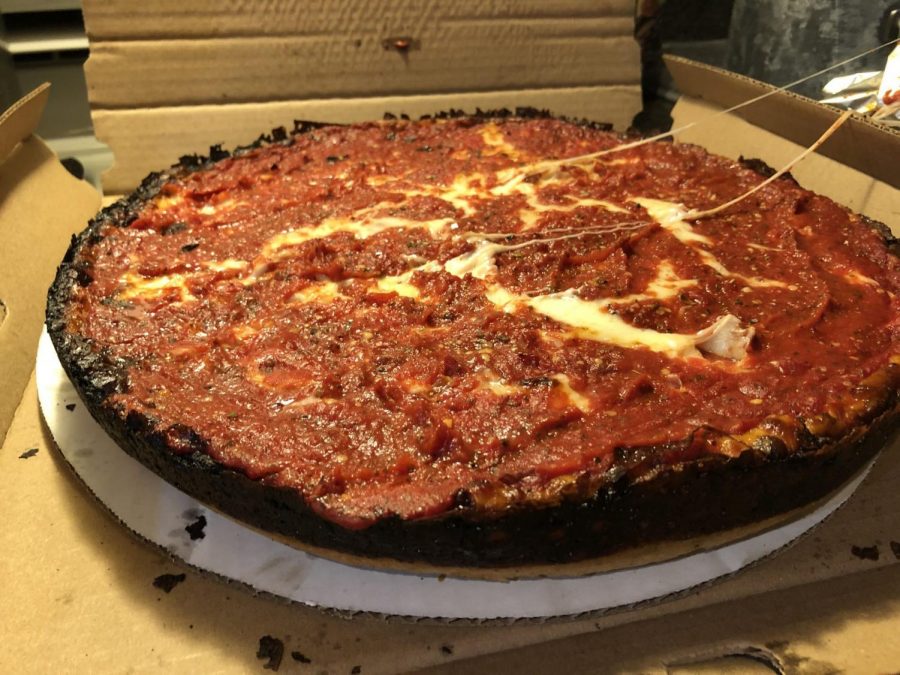 A large cheese pizza uniquely made in a pan from Pequod's Pizza located at 2207 N Clybourn Ave.
