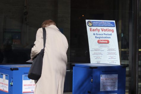 Voter casts their ballot early at Cook County Administration Building.
