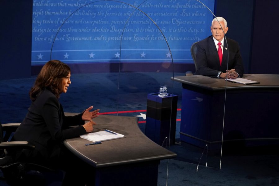 Vice President Mike Pence looks at Democratic vice presidential candidate Sen. Kamala Harris, D-Calif., as she answers a question during the vice presidential debate Wednesday, Oct. 7, 2020, at Kingsbury Hall on the campus of the University of Utah in Salt Lake City. (AP Photo/Morry Gash, Pool)