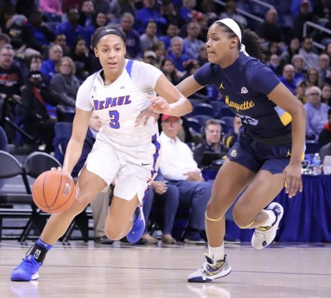 DePaul women's basketball senior Deja Church drives past a Marquette defender during the Big East championship game on March 9.