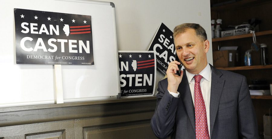 Rep. Sean Casten takes a phone call from his Downers Grove, Ill., office on Wednesday, Nov. 4, 2020.  Casten was elected to a second term after a challenge from Republican Jeanne Ives in historically GOP territory outside Chicago. (Mark Welsh/Daily Herald via AP)