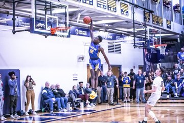 Ahamad Bynum goes up for a dunk during a high school in the 2019-2020 season. 