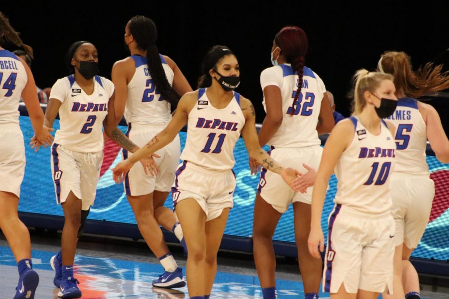 The DePaul womens basketball team shake hands during Mondays game against Chicago State.