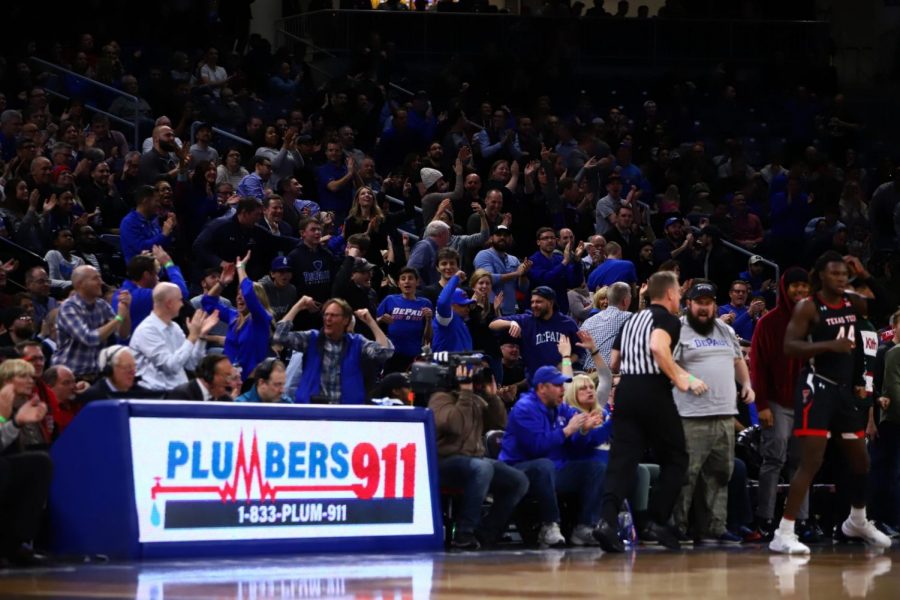 DePaul fans celebrate together during the Blue Demons game against Texas Tech on Dec. 4, 2019.