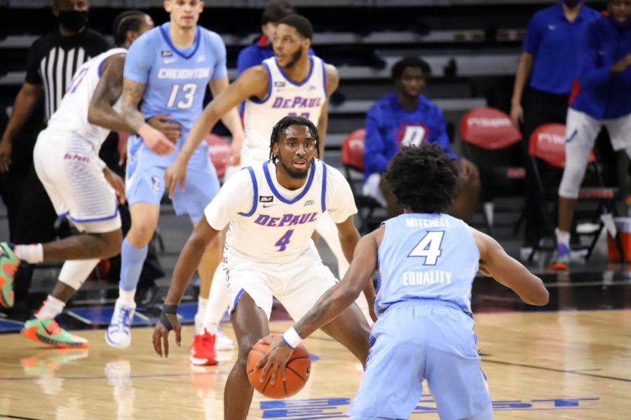 DePaul junior guard Javon Freeman-Liberty defends a Creighton player on Saturday at Wintrust Arena.