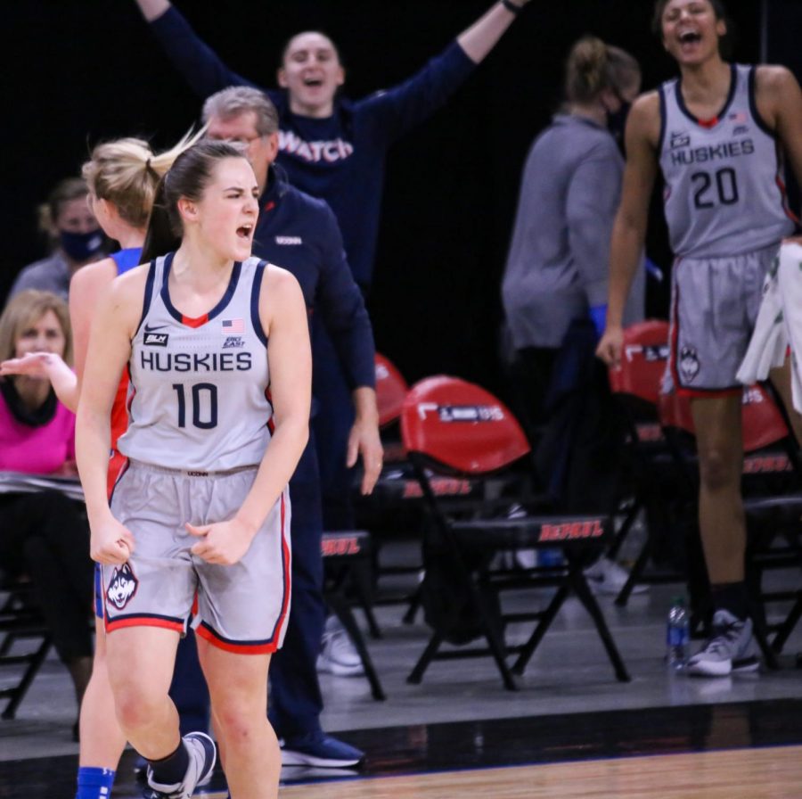 UConn guard Nika Muhl celebrates during the Huskies 100-67 victory on Sunday at Wintrust Arena.