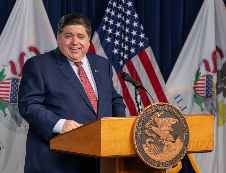 FILE-Illinois Governor JB Pritzker talks to journalism students, Thursday, Feb. 4, 2021, in the press room of the Thompson Center in downtown Chicago. Journalism students and faculty attended the candid discussion about the governor’s career and Illinois politics, followed by a question and answer session from the university's student media outlets. 