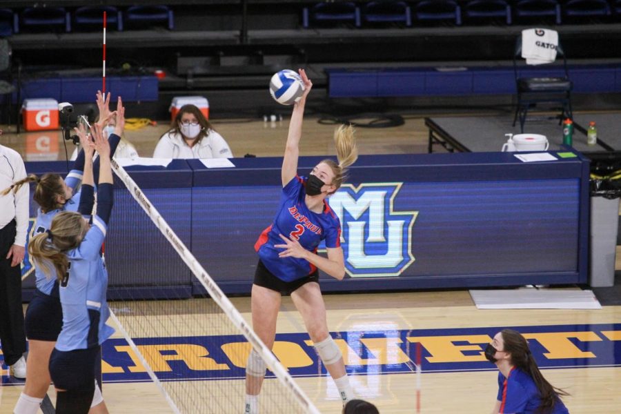 DePaul senior Emma Price goes up for a spike during a match against Marquette.