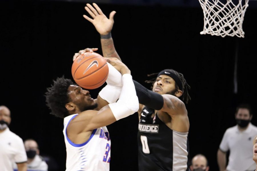 DePaul senior forward Pauly Paulicap has his shot blocked against Providence on Saturday at Wintrust Arena. 
