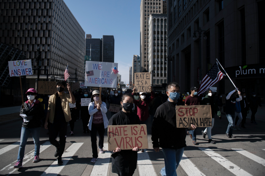 People march during the second consecutive weekend of Stop Asian Hate protests, Saturday March 27, 2021, on Woodward Avenue in Detroit.