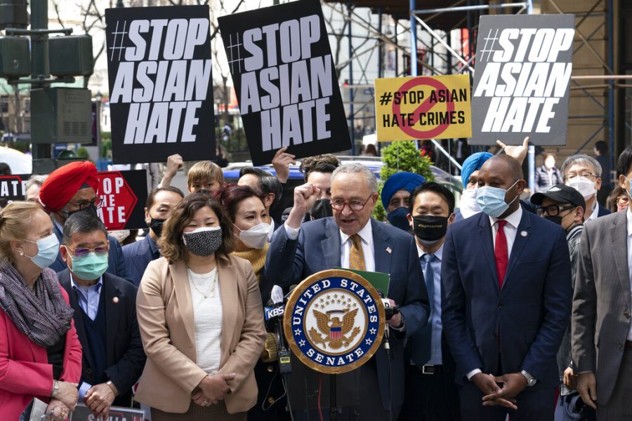 Senate Majority Leader Chuck Schumer, D-N.Y., center, is joined by U.S. Rep. Grace Meng, D-N.Y., third from left, at a news conference to discuss an Asian-American hate crime bill, Monday, April 19, 2021, in New York. Schumer is pushing for passage of the COVID-19 Hate Crimes Act in the Senate. (AP Photo/Mark Lennihan)