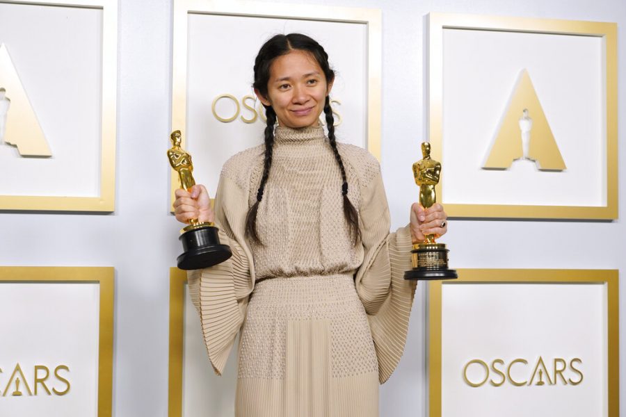 Chloe Zhao, winner of the awards for best picture and director for Nomadland, poses in the press room at the Oscars on Sunday, April 25, 2021, at Union Station in Los Angeles. (AP Photo/Chris Pizzello, Pool)