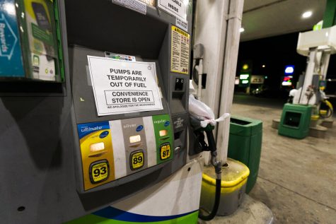 A pump at a gas station in Silver Spring, Md., is out of service, notifying customers they are out of fuel, Thursday, May 13, 2021. Motorists found gas pumps shrouded in plastic bags at tapped-out service stations across more than a dozen U.S. states Thursday while the operator of the nations largest gasoline pipeline reported making substantial progress in resolving the computer hack-induced shutdown responsible for the empty tanks. (AP Photo/Manuel Balce Ceneta)