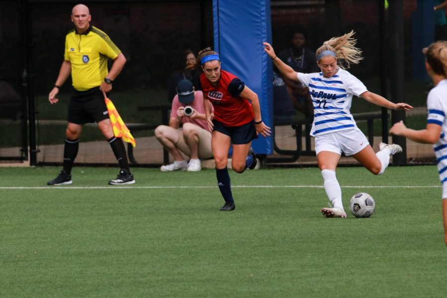 Sophomore+defender+Grace+Phillpotts+clears+a+ball+on+Sunday+against+UIC.+The+Blue+Demons+shut+out+the+Flames+3-0.