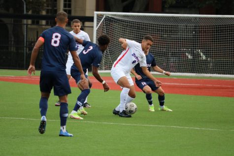 Midfielder Youssef Ramadan surrounded by Uconn defenders during their 2-1 win on Saturday. 