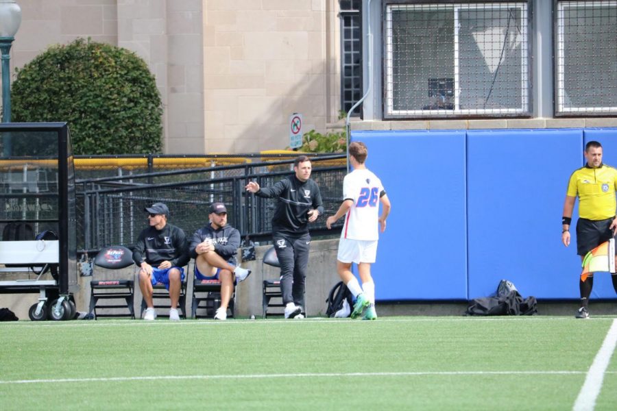 DePaul mens soccer coach Mark Plotkin talking to a player during their game against UConn on Sept 25. 