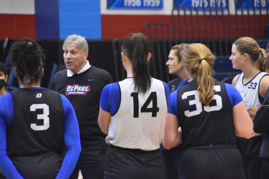 The+DePaul+womens+basketball+team+gather+around+to+listen+to+head+coach+Doug+Bruno+at+their+open+practice+on+Saturday.+