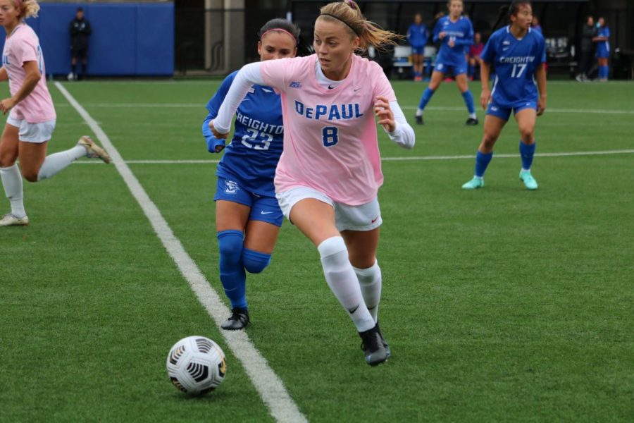 DePaul midfielder Emma Costow defending the ball from a Creighton player on Oct. 21.
