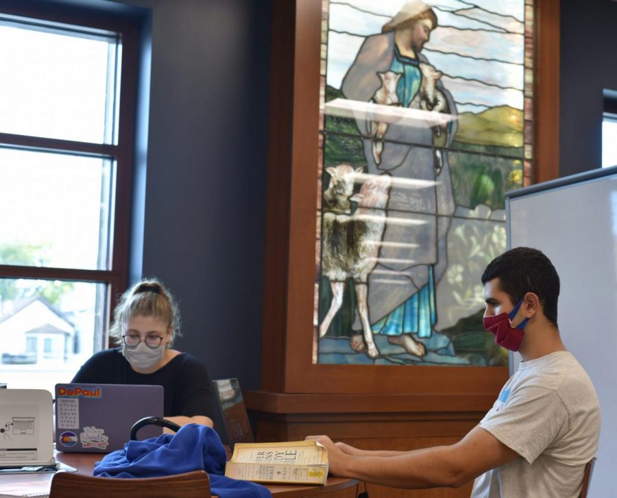 Students study at DePaul’s John T. Richardson Library in Lincoln Park, a building filled with religious imagery. 
