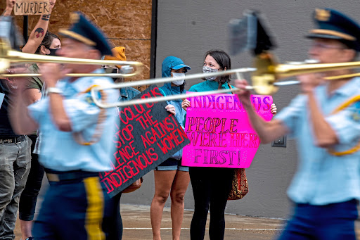 Protesters on the route of the Pittsburgh Columbus Day Parade Saturday, Oct. 9. (Alexandra Wimley/Pittsburgh Post-Gazette via AP)