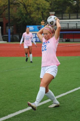 Grace Phillpotts preparing to throw in the ball at the DePaul womens soccer Pink Out game on Oct. 21. 