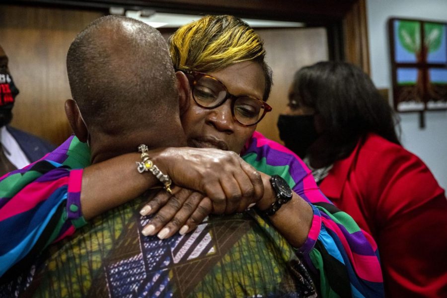 Ahmaud Arbery's mother, Wanda Cooper-Jones his hugged by a supporter after the jury convicted Travis McMichael in the trial of McMichael, his father, Greg McMichael, and neighbor, William 