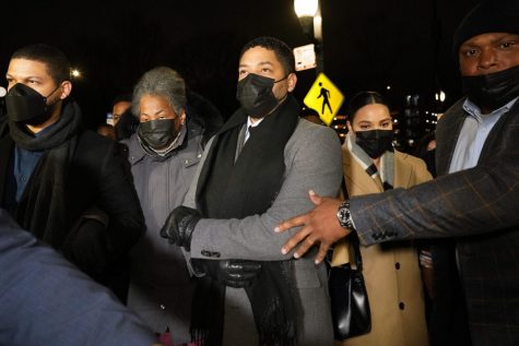 Actor Jussie Smollett, center, along with his mother Janet, second from left, returns to the Leighton Criminal Courthouse, Thursday, Dec. 9, 2021, in Chicago, after a jury reached a verdict in his trial. Smollett was convicted Thursday on five of six charges he staged an anti-gay, racist attack on himself nearly three years ago and then lied to Chicago police about it.