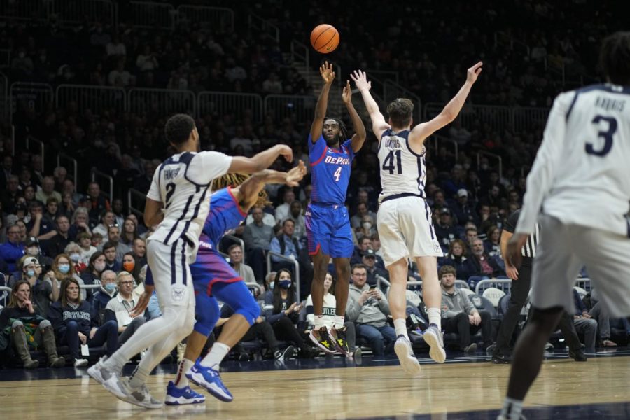 DePaul guard Javon Freeman-Liberty (4) shoots over Butler guard Simas Lukosius (41) in the second half of an NCAA college basketball game in Indianapolis, Wednesday, Dec. 29, 2021. Butler won 63-59.