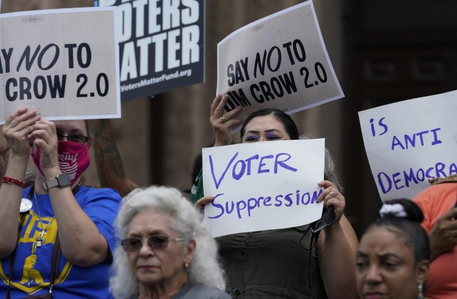 Demonstrators join a rally to protest proposed voting bills on the steps of the Texas Capitol on July 13, 2021, in Austin, Texas. 