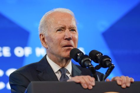 President Joe Biden speaks at the U.S. Conference of Mayors 90th Annual Winter Meeting at the Capitol Hilton in Washington, Friday, Jan. 21, 2022. (AP Photo/Andrew Harnik)