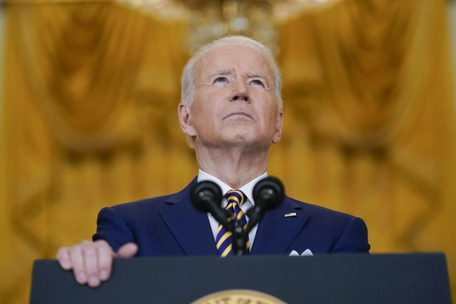 President Joe Biden pauses as he speaks during a news conference in the East Room of the White House in Washington, Wednesday, Jan. 19, 2022. 