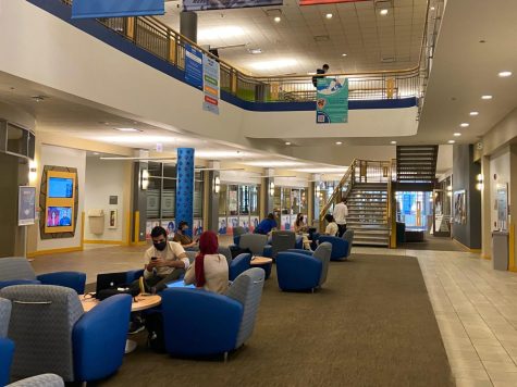 Students in the Student Center main floor seating area. DePaul returns to in-person classes on January 17th.