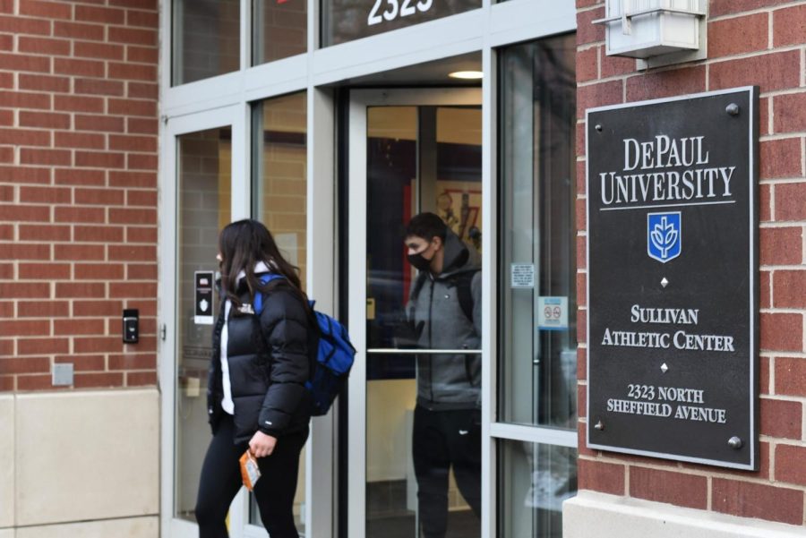 Students walk out of the Sullivan Athletic Center, where DePaul Lincoln Park on campus Covid-19 testing is taking place.
