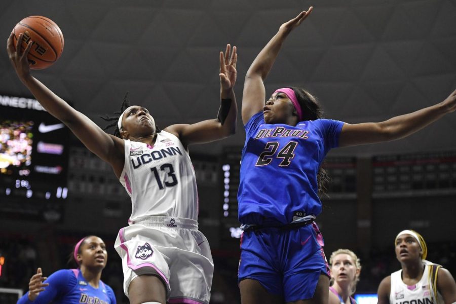Connecticuts Christyn Williams (13) shoots over DePauls Aneesah Morrow (24) in the first half of an NCAA college basketball game, Friday, Feb. 11, 2022, in Storrs, Conn. (AP Photo/Jessica Hill)