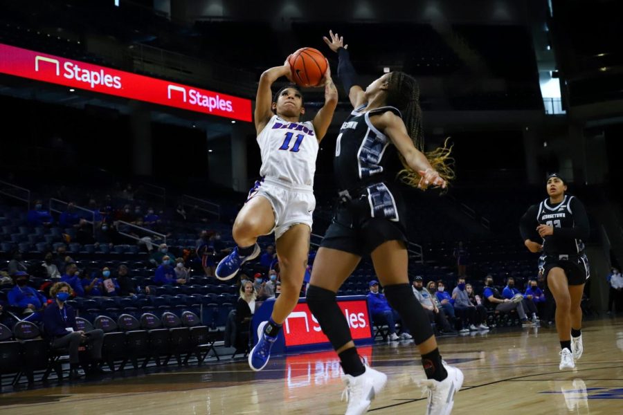 DePaul womens basketball guard Sonya Morris jumping with the ball against Georgetown on Jan. 16. 