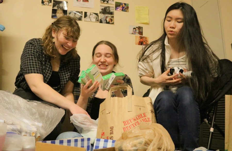 Freshmen+Jillian+Muncaster%2C+Amber+Rosegay+and+Casey+Fong+organize+their+donations.+All+donations+will+go+towards+the+Grace+House.