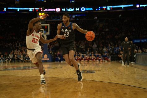DePaul senior guard Courvoisier McCauley looks to drive past a St. Johns defender at Madison Square Garden Wednesday night. 