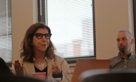 Faculty Council member Andrea Kayne speaks to members in attendance at a meeting in April.