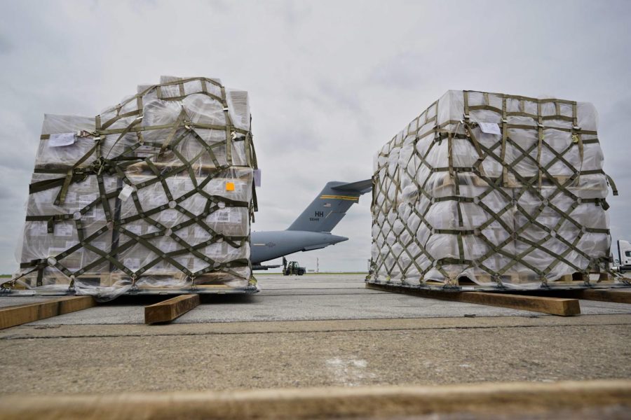 Pallets of baby formula wait to be transferred to a truck after arriving on an Air Force C-17 at the Indianapolis International Airport in Indianapolis, Sunday, May 22, 2022. The 132 pallets of Nestlé Health Science Alfamino Infant and Alfamino Junior formula arrived from Ramstein Air Base in Germany. (AP Photo/Michael Conroy)