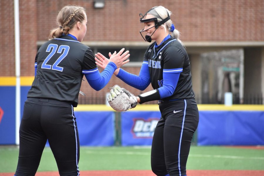 Freshman Anna Wohlers high fives graduate student Sarah Lehman in DePaul's 7-1 win over Villanova on April 2. They are both returning next season.