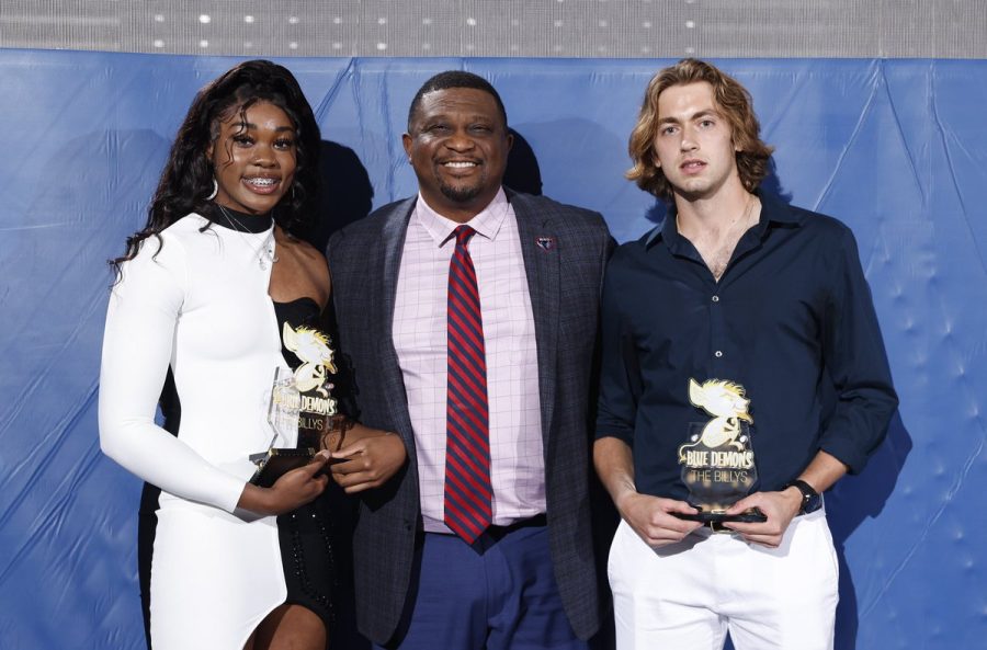 Photo credit: DePaul Athletics/DePaul Womens Basketball twitter. Athletic director DeWayne Peevy stands with womens basketball freshman Aneesah Morrow (left) and mens tennis junior Vito Tonejc (right) as they hold their trophies at the Billy Awards.