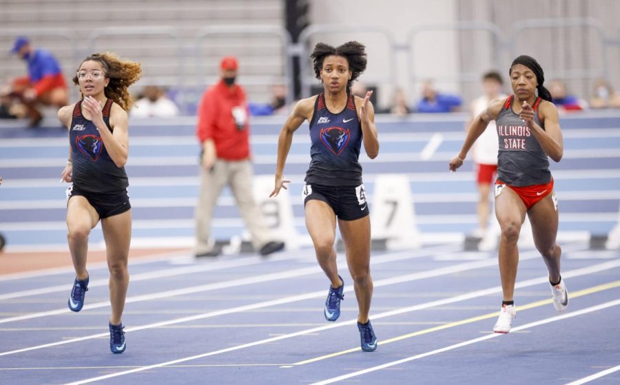 Tori Carroll races past a teammate and Illinois State opponent.