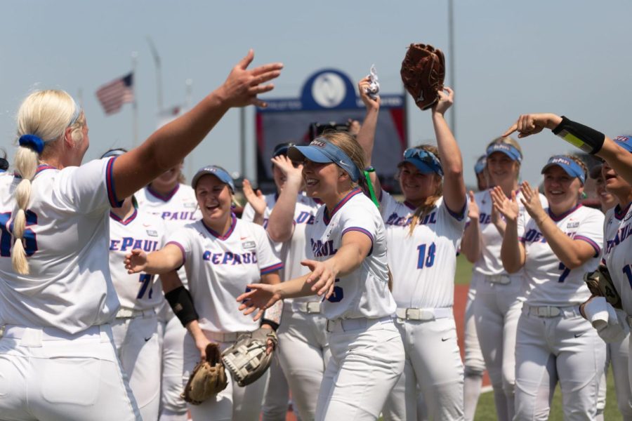 DePaul+softball+cheers+as+pitcher+Sarah+Lehman+walks+towards+them.+Lehman+struck+out+five+and+only+allowed+two+hits+in+the+Blue+Demons+6-2+over+UConn+on+May+12.