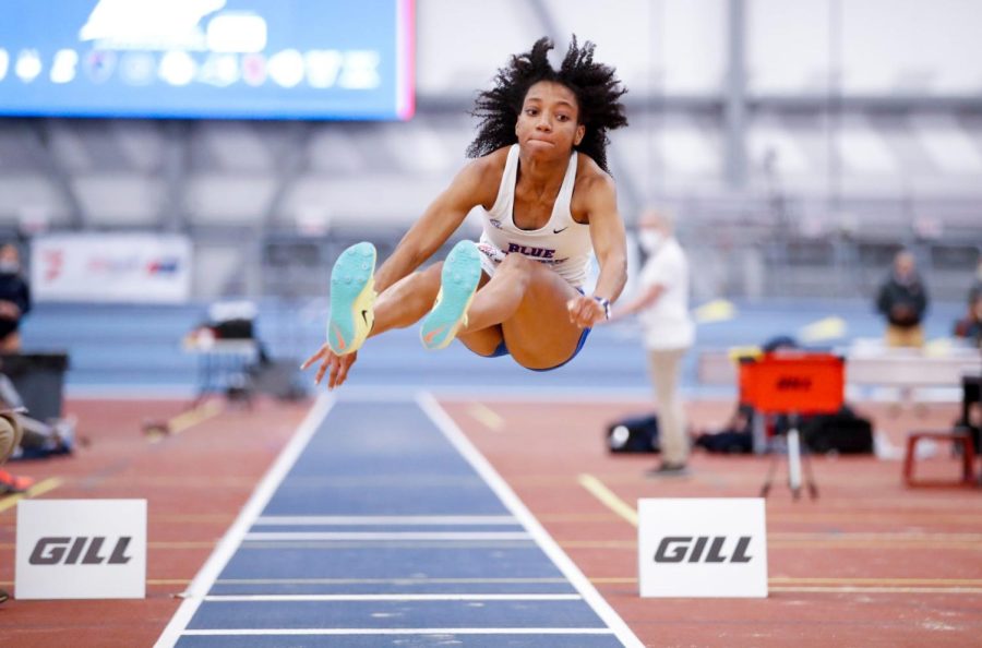 DePaul track and field junior Tori Carroll leaps in a long jump event at the Big East Indoor Championship on Feb. 25, where she placed second.