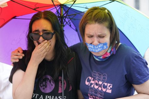 Abortion-rights activists react after hearing the Supreme Court decision on abortion outside the Supreme Court in Washington, Friday, June 24, 2022.TheSupreme Courthas ended constitutional protections for abortion that had been in place nearly 50 years in a decision by its conservative majority to overturn Roe v. Wade.
