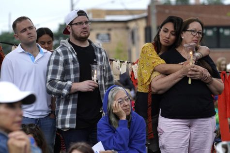 Residents from around the Highland Park, Ill., area listen during a vigil in Highwood, Ill., for the victims of Mondays Highland Park Fourth of July parade mass shooting, Wednesday, July 6, 2022.