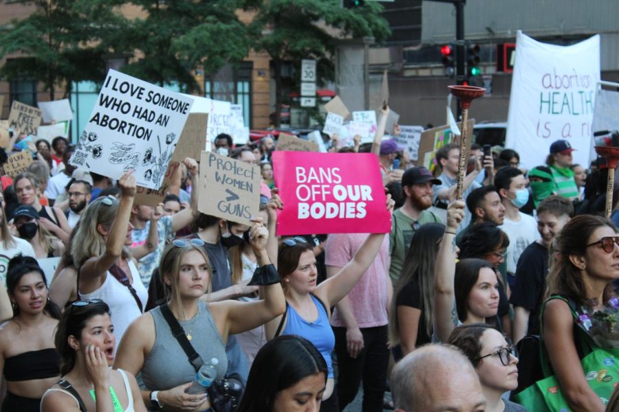 Activists March along Dearborn Street in Chicago on June 25 in response to SCOTUS overturn of Roe v. Wade.