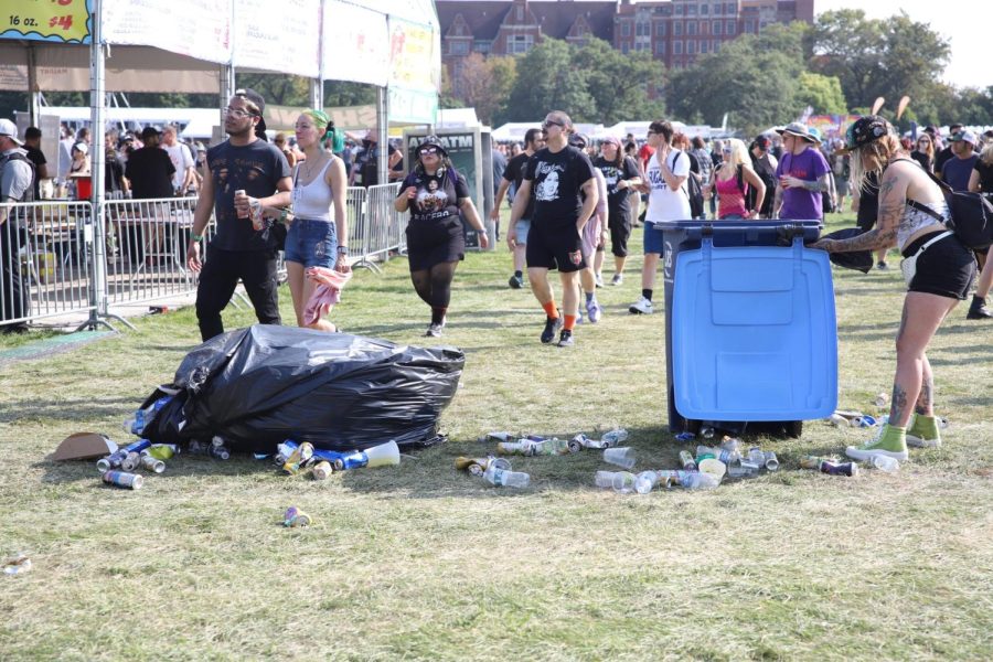 Riot Fest goers walk past garbage in Douglass Park. West Side residents say Riot Fest has heightened traffic congestion, trauma hospital disruption and lack of access to the park.