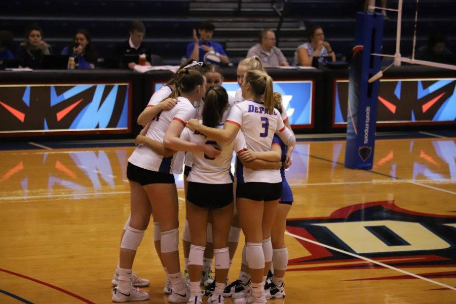 DePaul starters stand together for a pre-game huddle prior to their match with Saint Louis on Saturday.